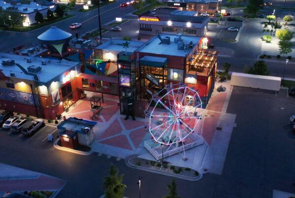 Drone view of a ferris wheel with permanent lighting